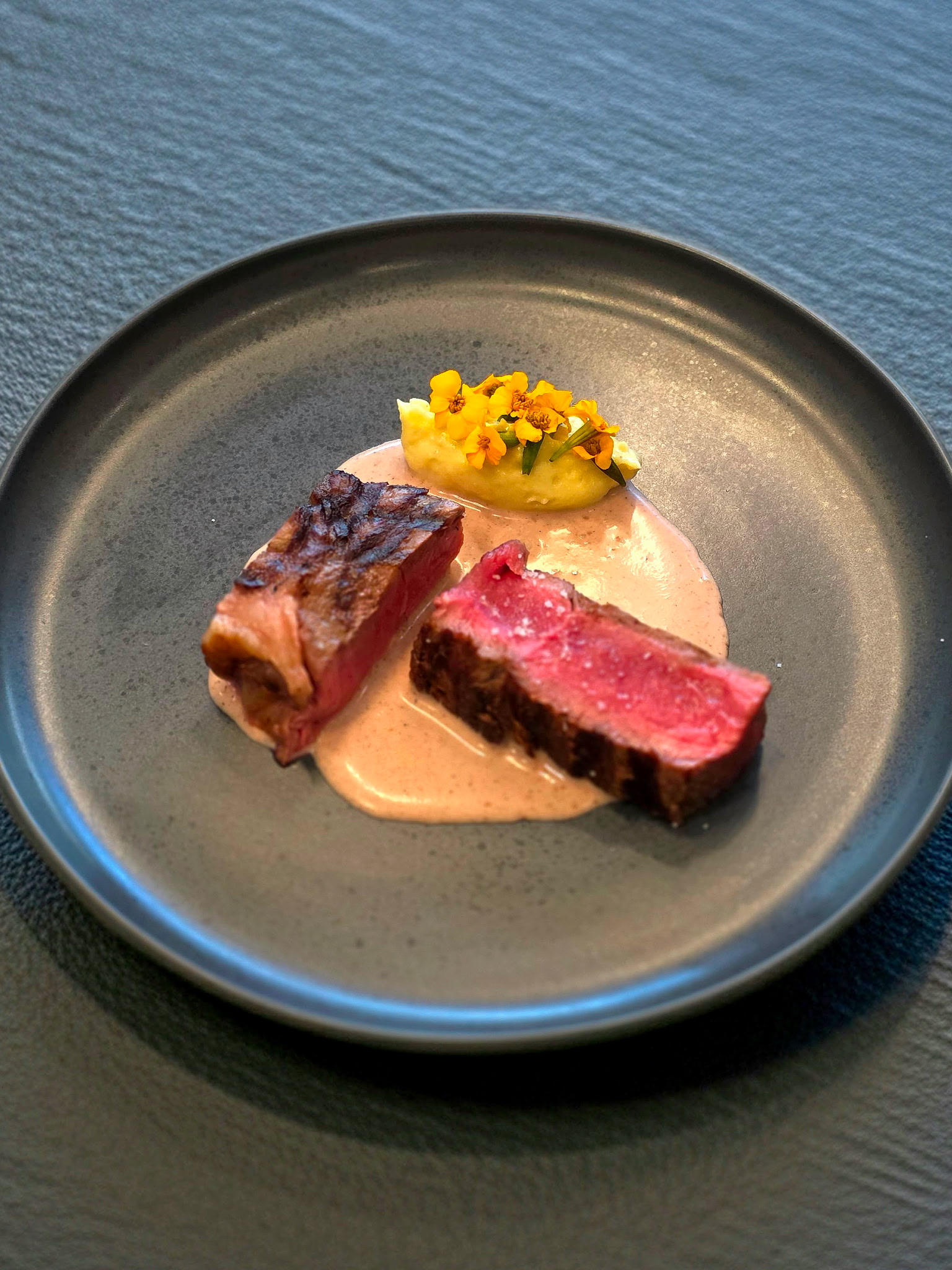 Medium-rare steak with yellow puree